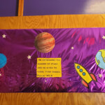 Children cutouts of planets.