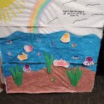 Drawing of the sea with fish and crabs.