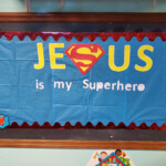 Sign 'Jesus is my Superhero'.
